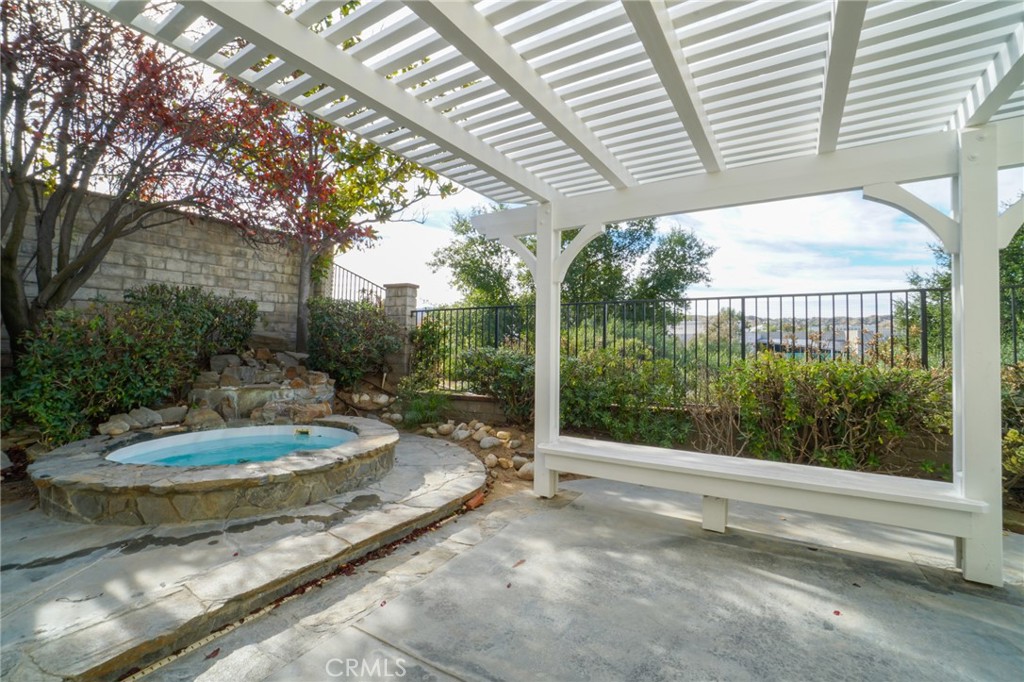 26433 Emerald Dove Drive Valencia, CA 91355 - Photo 39 of 50 a view of a patio with table and chairs and a large tree