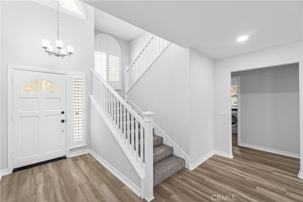 26433 Emerald Dove Drive Valencia, CA 91355 - Photo 4 of 50 a view of livingroom with wooden floor and stairs