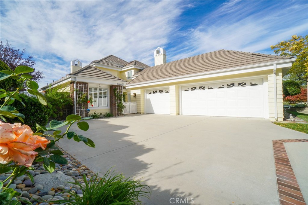 26433 Emerald Dove Drive Valencia, CA 91355 - Photo 43 of 50 a view of a house with a yard and plants