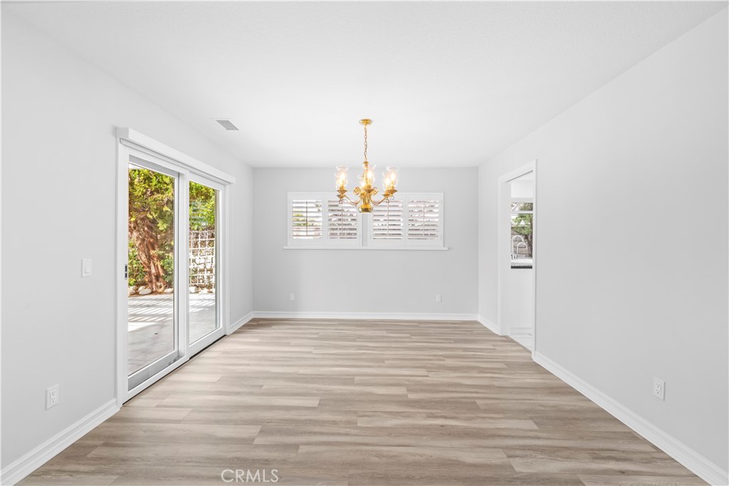 26433 Emerald Dove Drive Valencia, CA 91355 - Photo 5 of 50 wooden floor in an empty room with a window