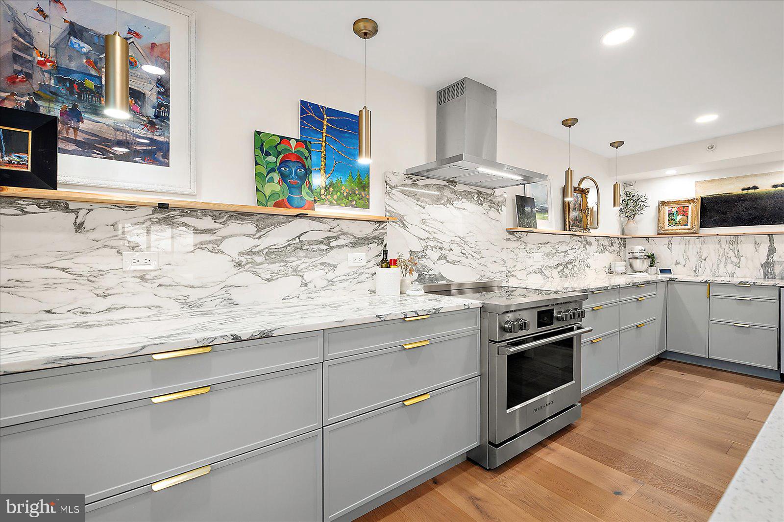 11000 Coastal Highway, Unit 2000 Ocean City, MD 21842 - Photo 20 of 102 a kitchen with stainless steel appliances granite countertop a sink and a stove top oven