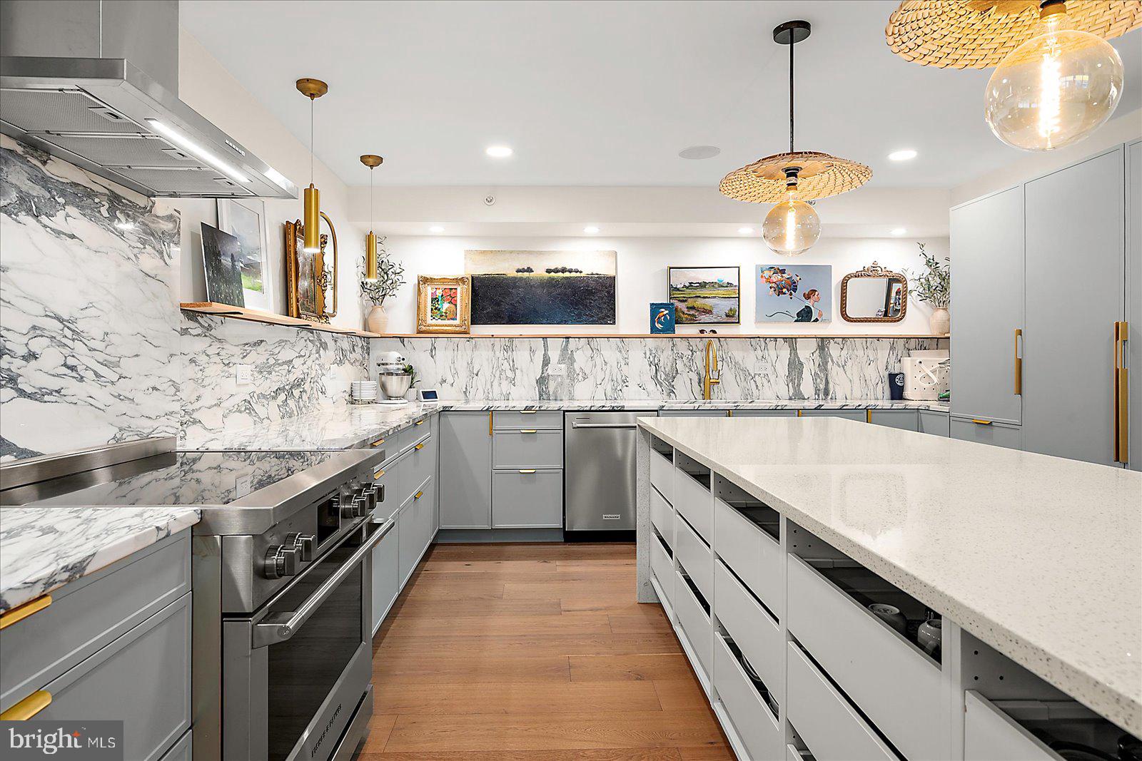 11000 Coastal Highway, Unit 2000 Ocean City, MD 21842 - Photo 21 of 102 a large kitchen with stainless steel appliances granite countertop a sink a stove and oven