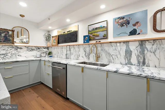 a bedroom with a bed and a potted plant