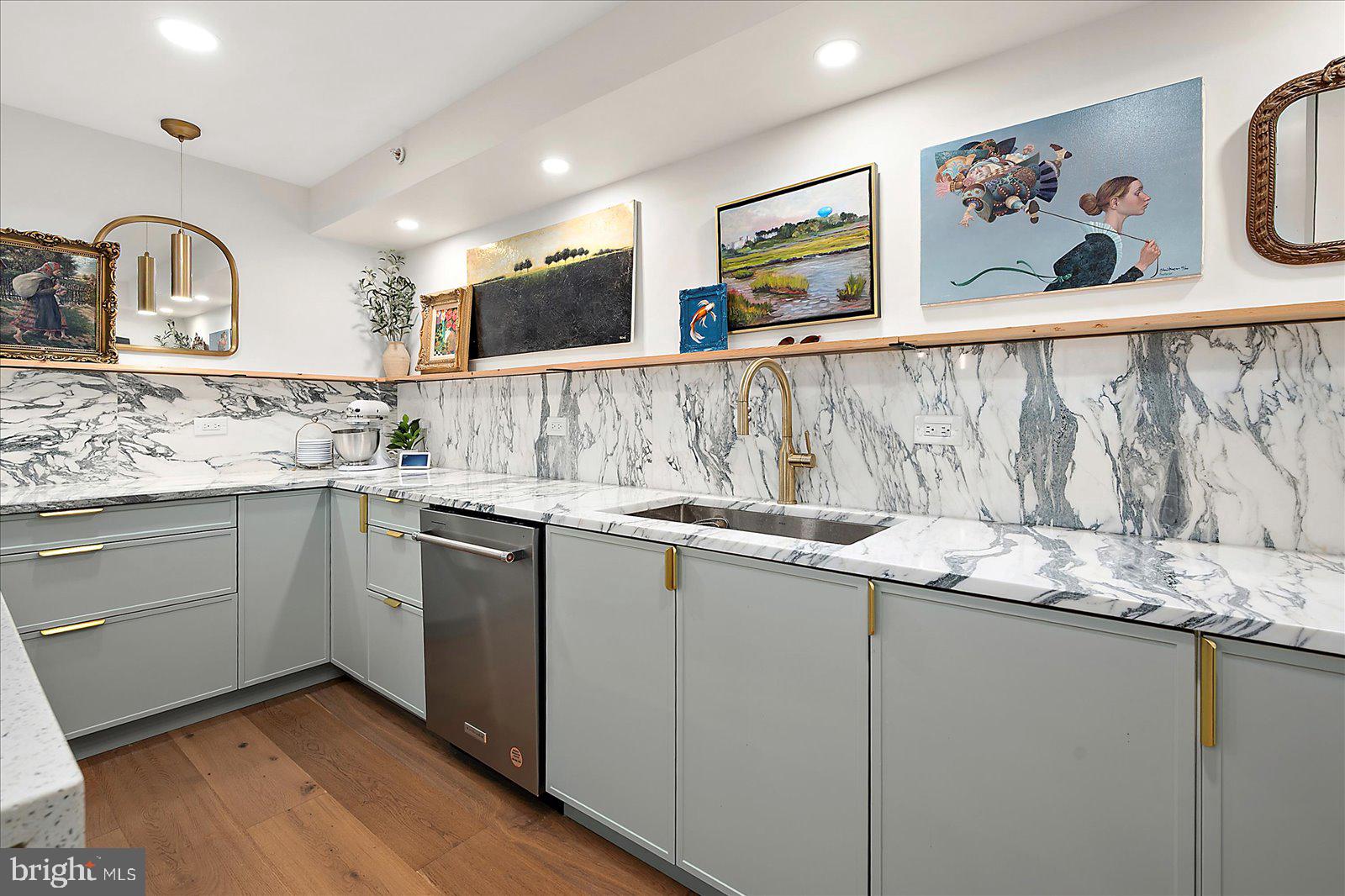 11000 Coastal Highway, Unit 2000 Ocean City, MD 21842 - Photo 25 of 102 a kitchen with stainless steel appliances granite countertop a sink and cabinets