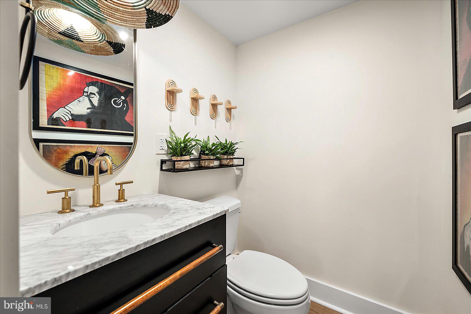 11000 Coastal Highway, Unit 2000 Ocean City, MD 21842 - Photo 31 of 102 a bathroom with a granite countertop sink and a mirror
