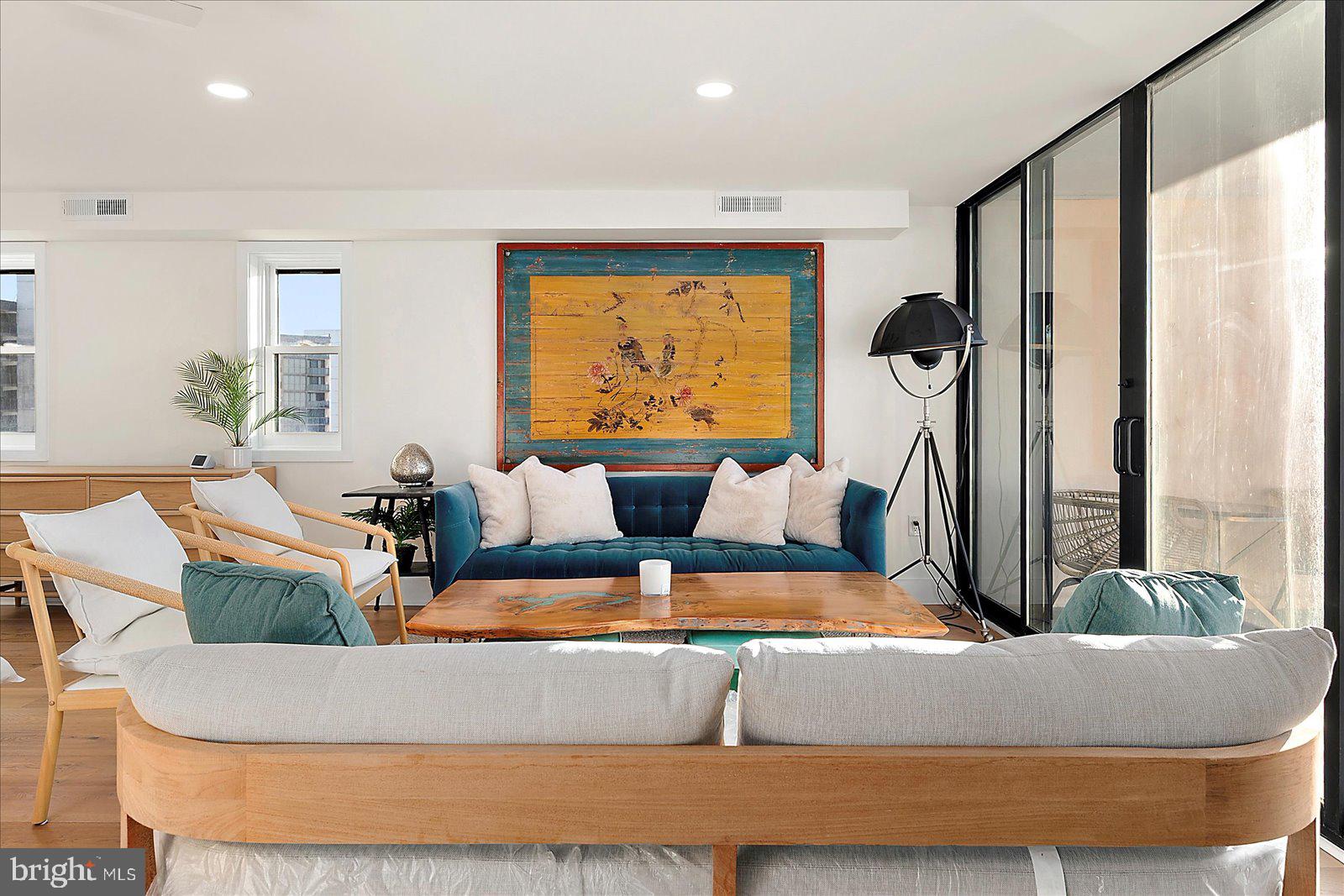 11000 Coastal Highway, Unit 2000 Ocean City, MD 21842 - Photo 35 of 102 a living room with furniture and a large window