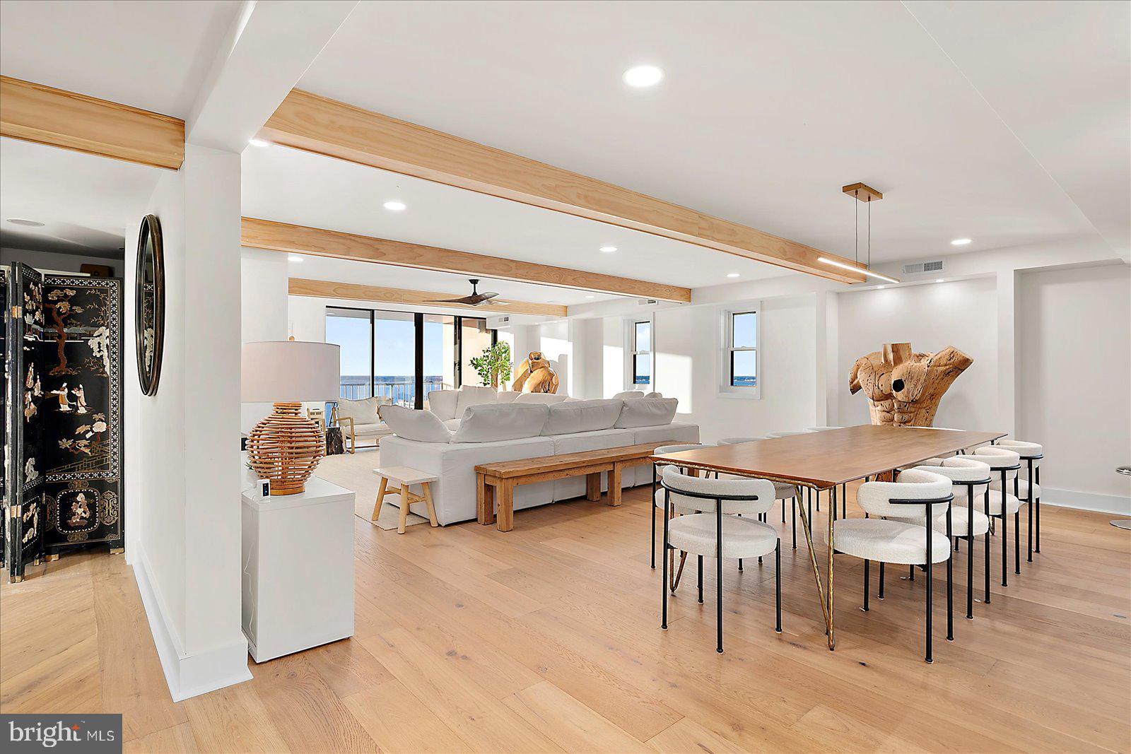 11000 Coastal Highway, Unit 2000 Ocean City, MD 21842 - Photo 4 of 102 a dining hall with stainless steel appliances kitchen island granite countertop a table and chairs