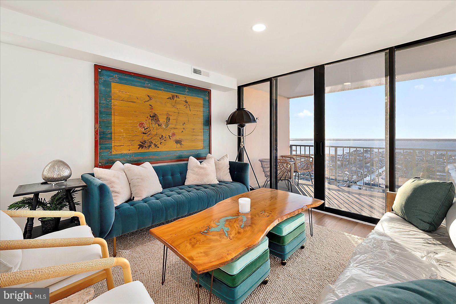 11000 Coastal Highway, Unit 2000 Ocean City, MD 21842 - Photo 41 of 102 a bedroom with furniture and a large window