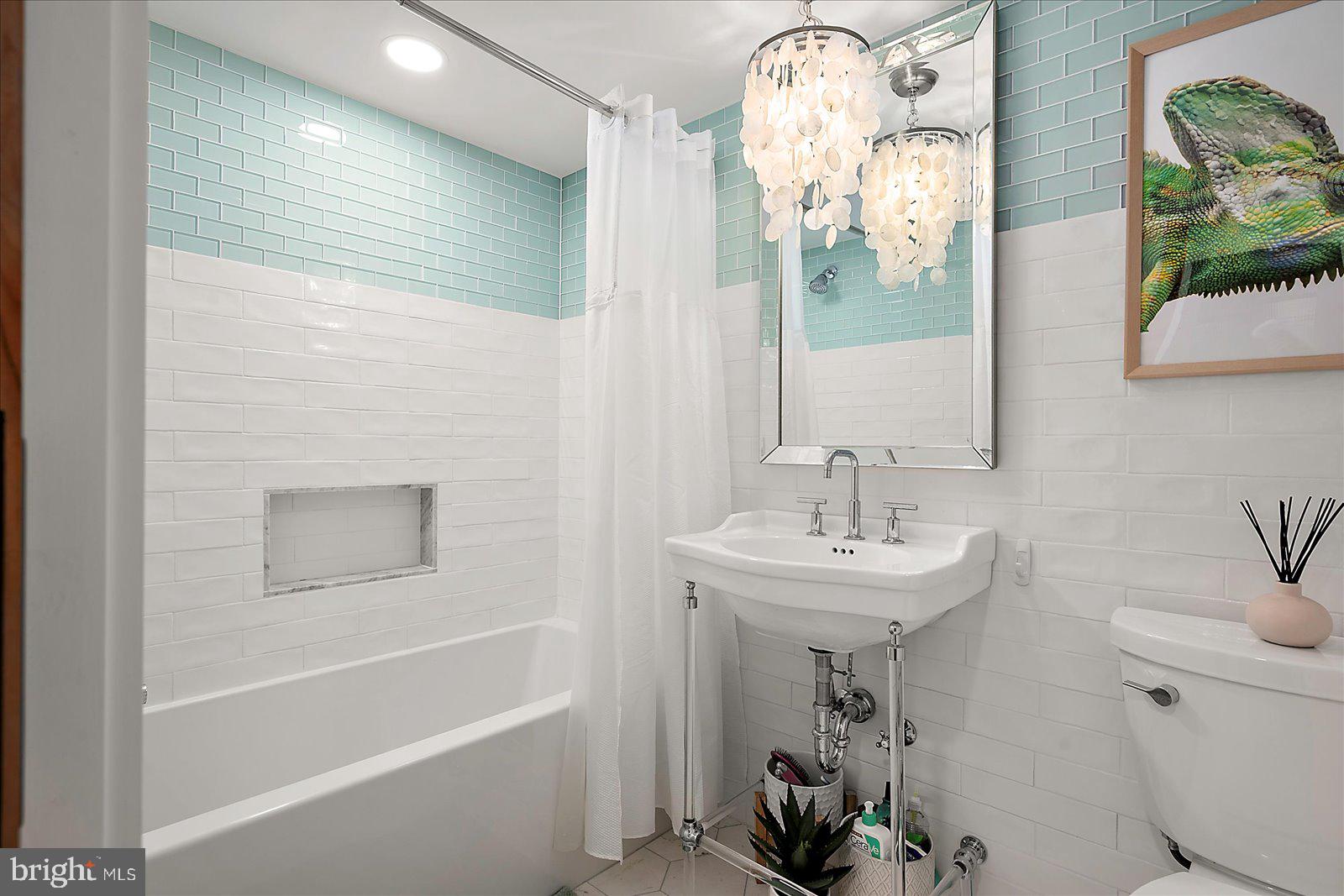 11000 Coastal Highway, Unit 2000 Ocean City, MD 21842 - Photo 55 of 102 a bathroom with a sink a toilet and shower