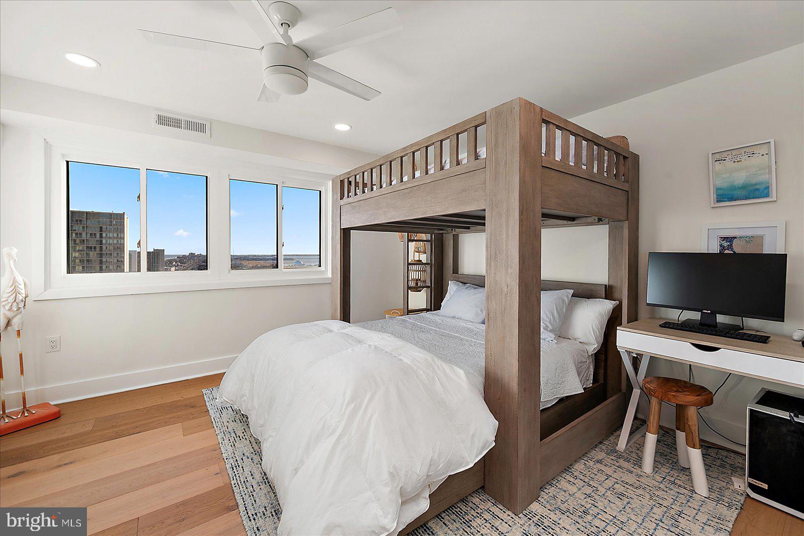 11000 Coastal Highway, Unit 2000 Ocean City, MD 21842 - Photo 68 of 102 a bedroom with a bed and a flat screen tv