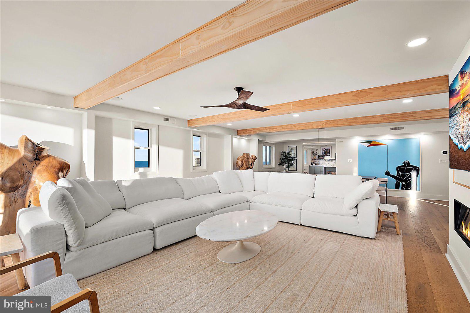 11000 Coastal Highway, Unit 2000 Ocean City, MD 21842 - Photo 7 of 102 a living room with furniture and a large window