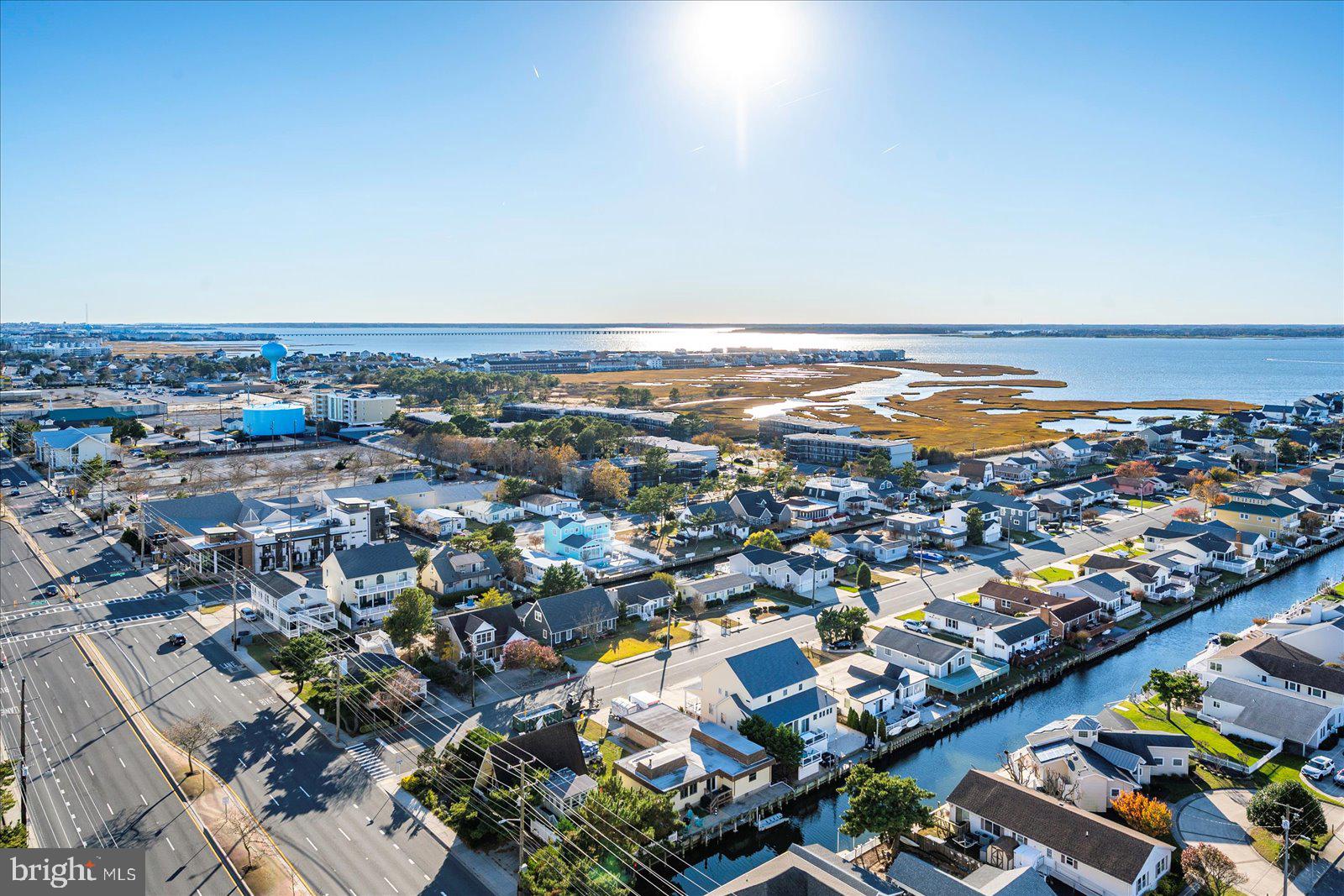 11000 Coastal Highway, Unit 2000 Ocean City, MD 21842 - Photo 75 of 102 an aerial view of a city with lots of residential buildings and ocean view in back