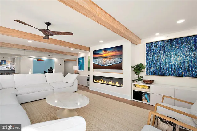 a kitchen with stainless steel appliances granite countertop a kitchen island hardwood floor sink and stove