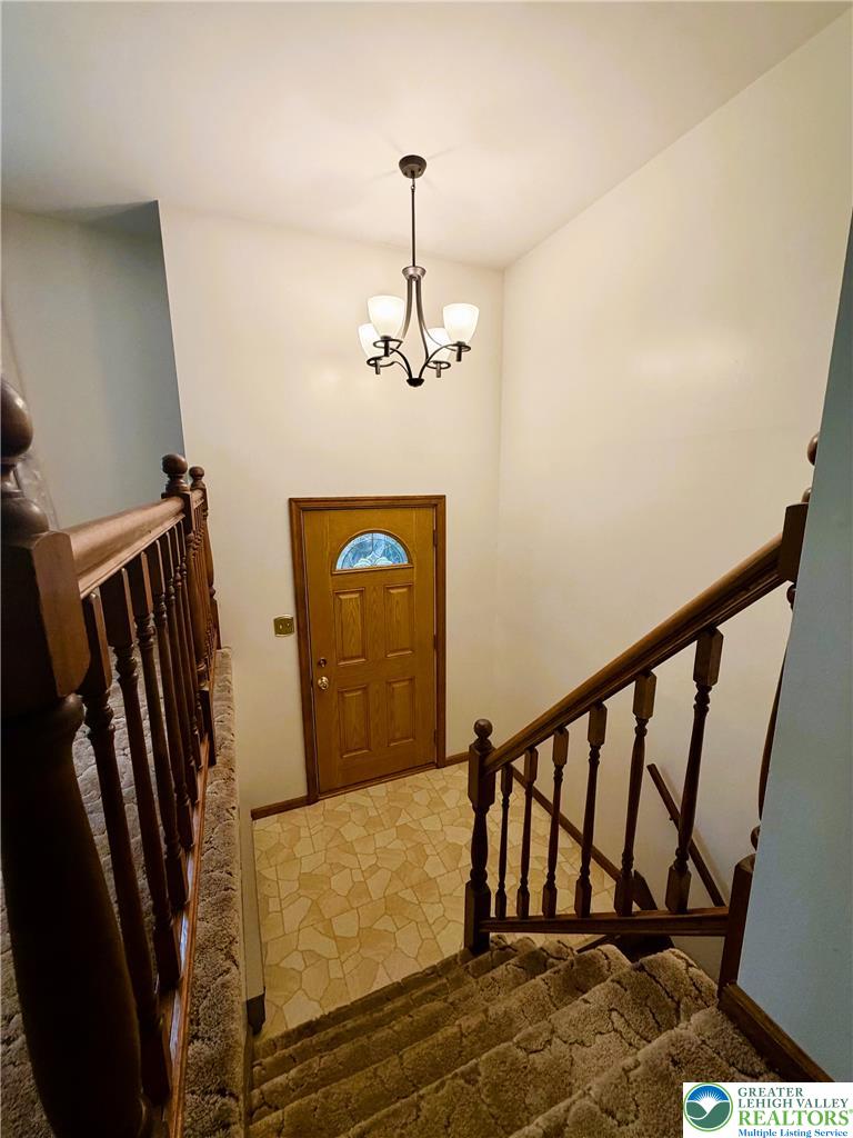 525 Pinewood Road Lehighton, PA 18235 - Photo 25 of 51 A welcoming entryway with classic staircase leading to the 1st & Lower level