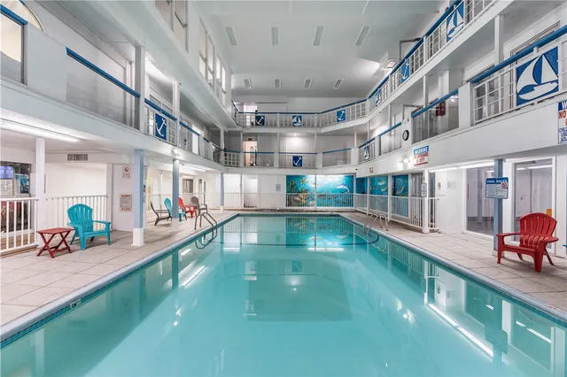 a view of a kitchen with a large window and sitting area