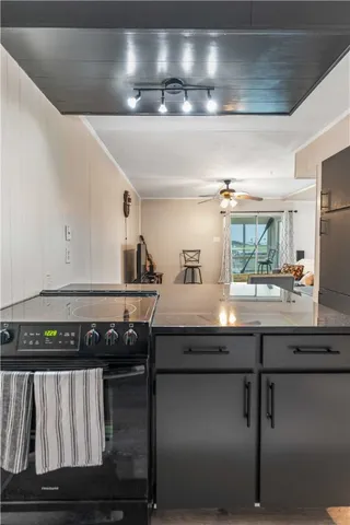 a kitchen with a stove and cabinets
