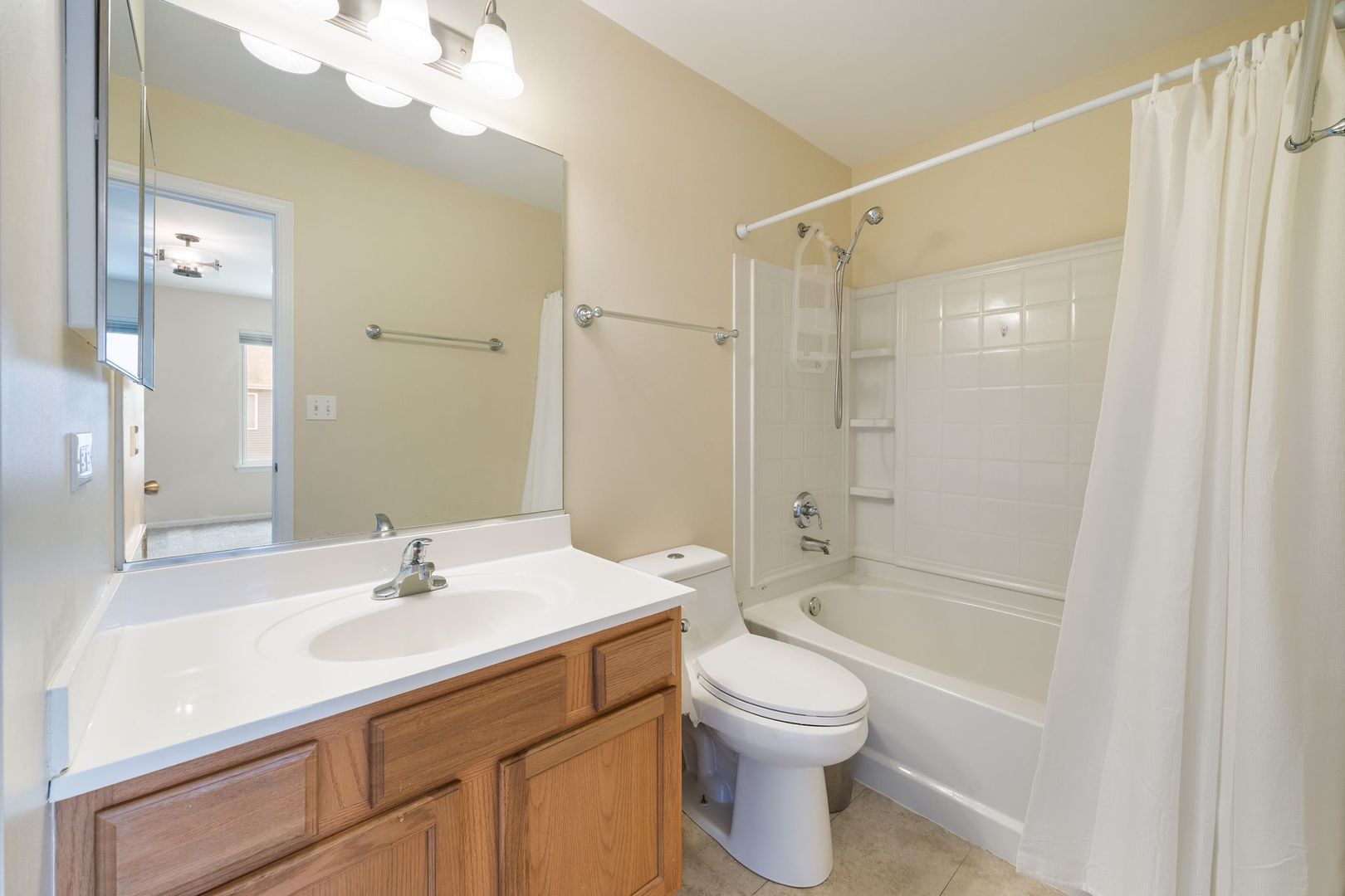 893 Emerald Drive Pingree Grove, IL 60140 - Photo 12 of 18 a bathroom with a sink a toilet and shower