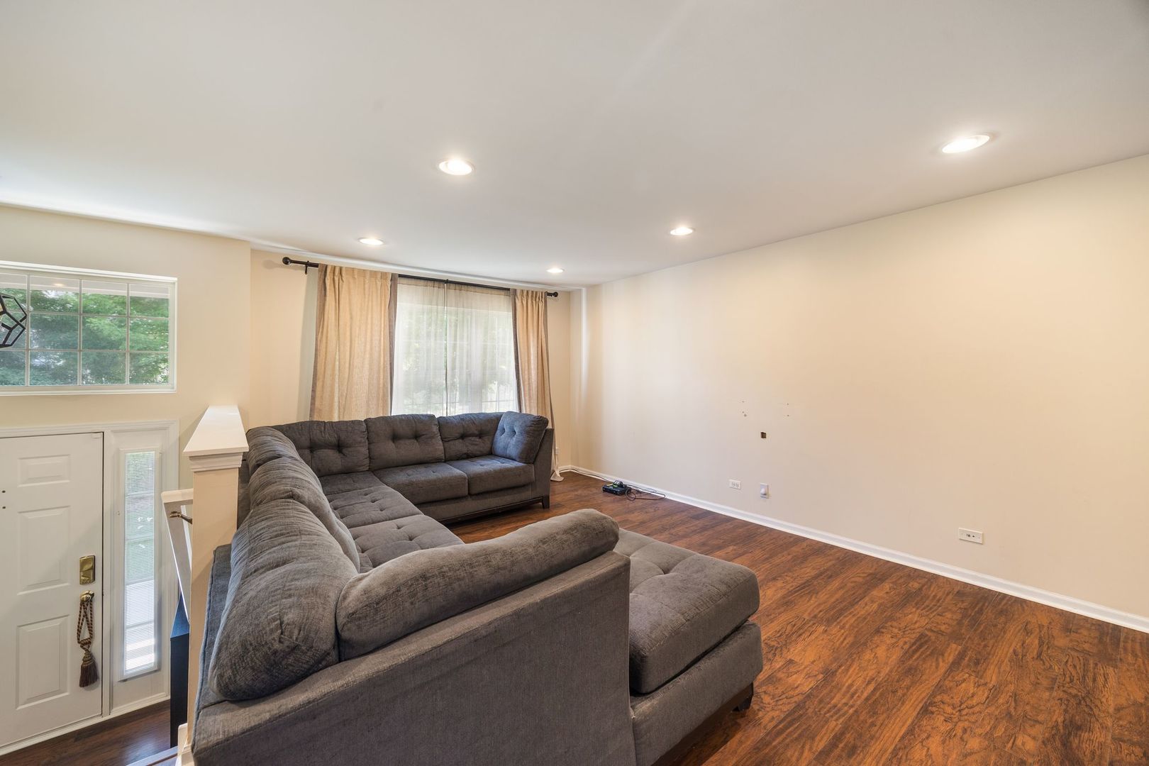 893 Emerald Drive Pingree Grove, IL 60140 - Photo 3 of 18 a living room with furniture and a couch