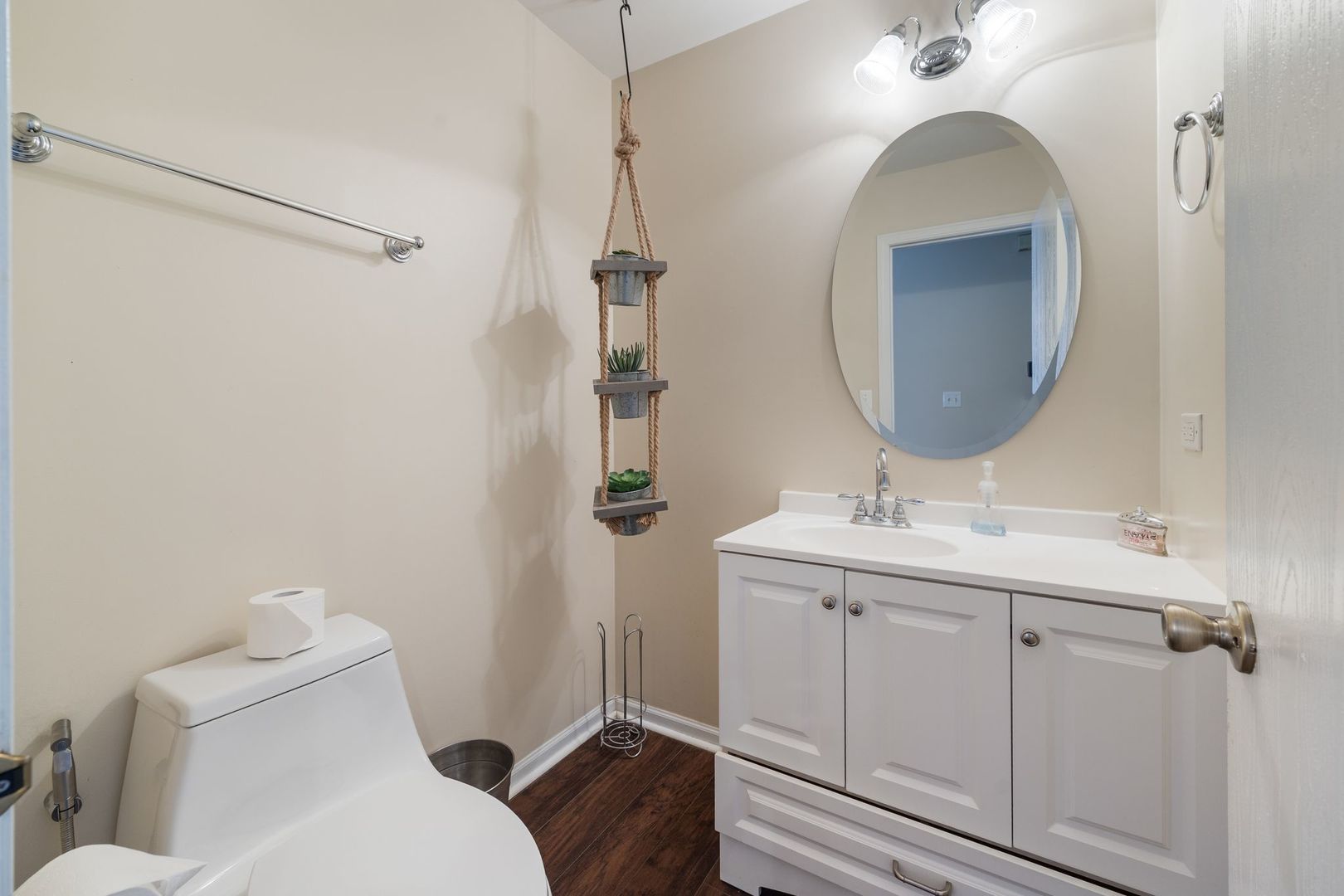 893 Emerald Drive Pingree Grove, IL 60140 - Photo 9 of 18 a bathroom with a toilet a sink and mirror