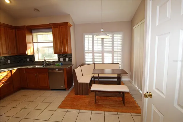 a kitchen with a sink and a window