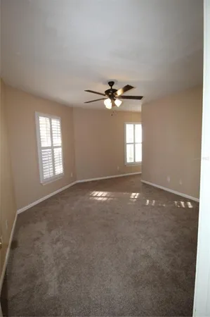 an empty room that has a window in it