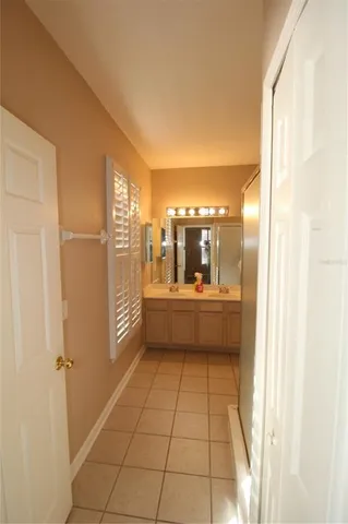a bathroom with a mirror and a shower