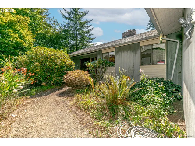 a view of front of house with a yard