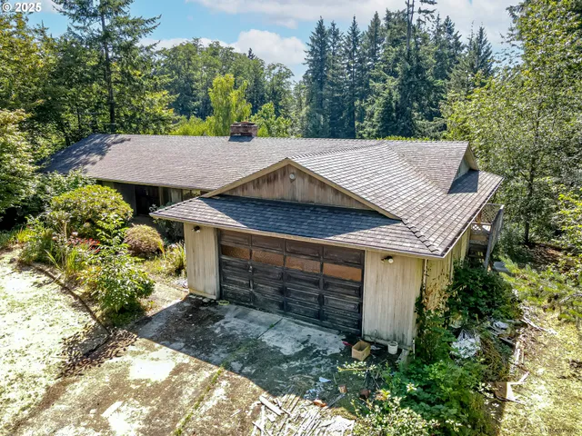 an aerial view of a house with a garden