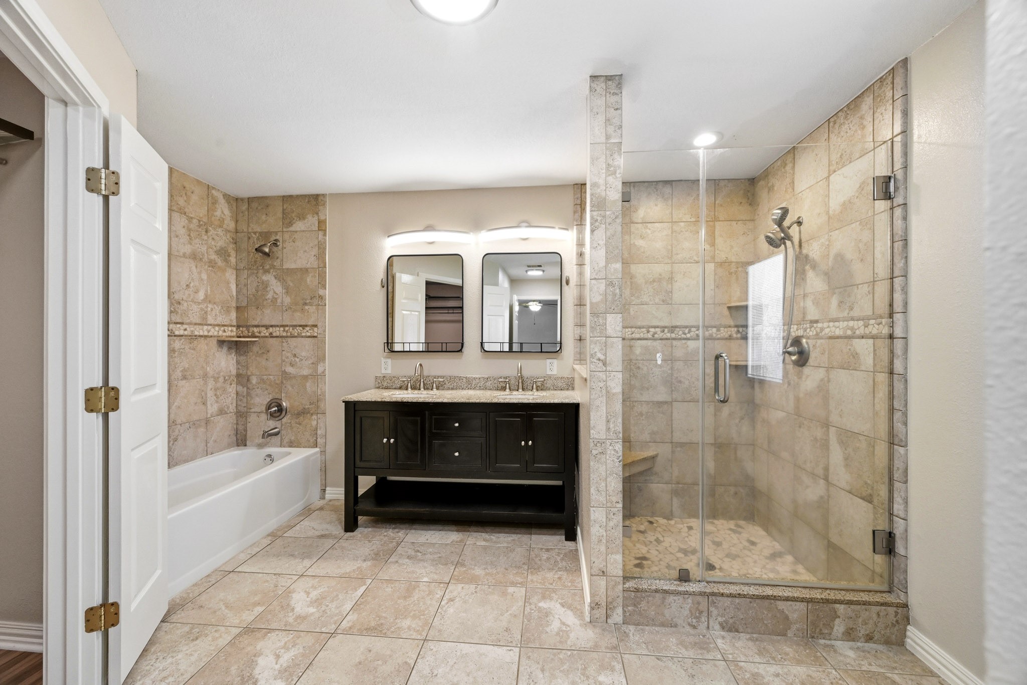 3602 Sweet Gum Spring, TX 77388 - Photo 17 of 30 a bathroom with a bathtub and a shower