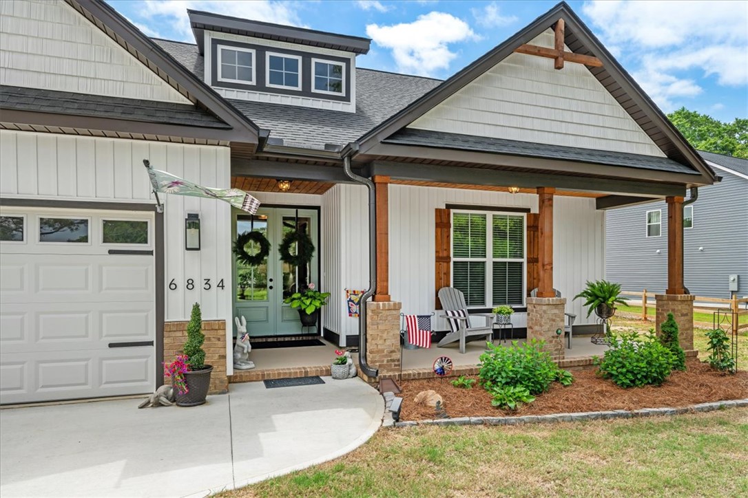 6834 Midway Road Pelzer, SC 29669 - Photo 1 of 50 This charming residence features a well-maintained exterior and a welcoming porch, perfect for outdoor relaxation.