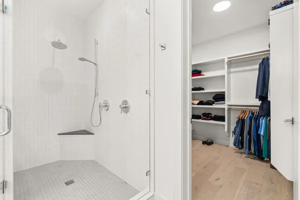 a bathroom with a bathtub and a shower