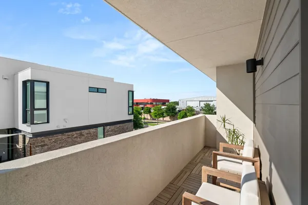 a view of balcony and wooden floor