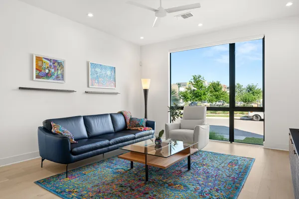 a living room with furniture and a rug
