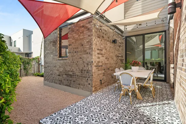 a outdoor dining space with furniture