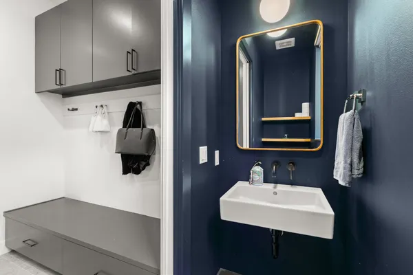 a bathroom with a sink and mirror