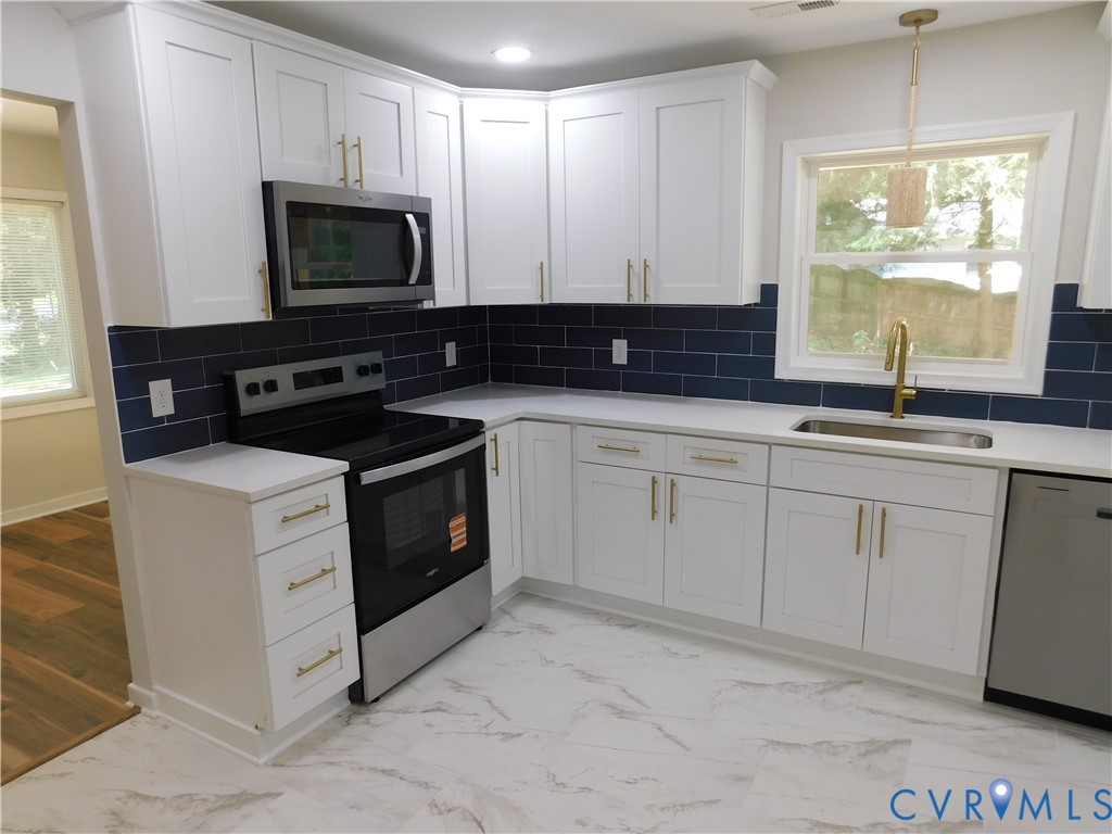 5322 Adams Road Quinton, VA 23141 - Photo 6 of 56 White shaker cabinetry with gold-tone hardware, st