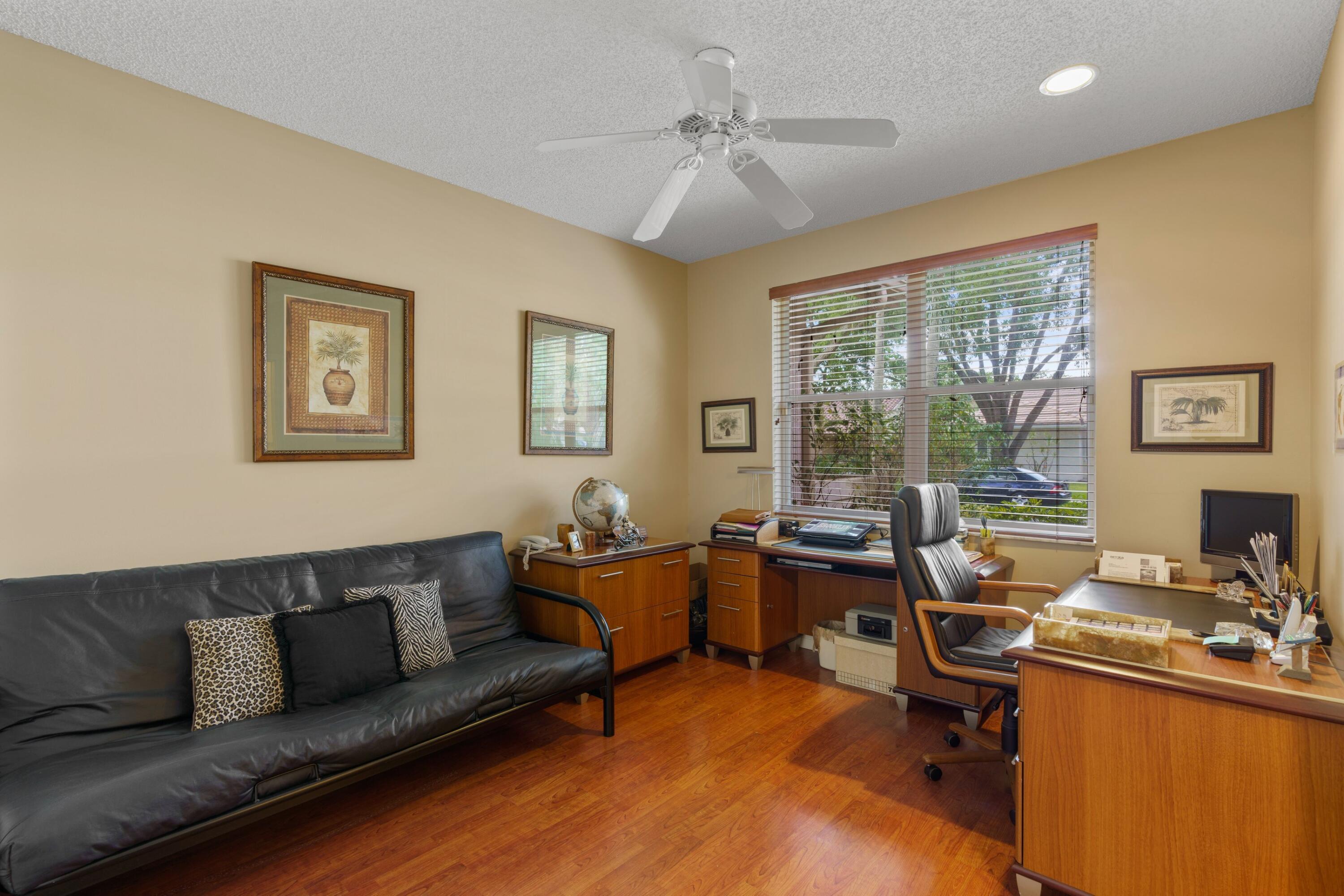 2687 Northwest 39th Street Boca Raton, FL 33434 - Photo 17 of 34 a living room with furniture and large windows