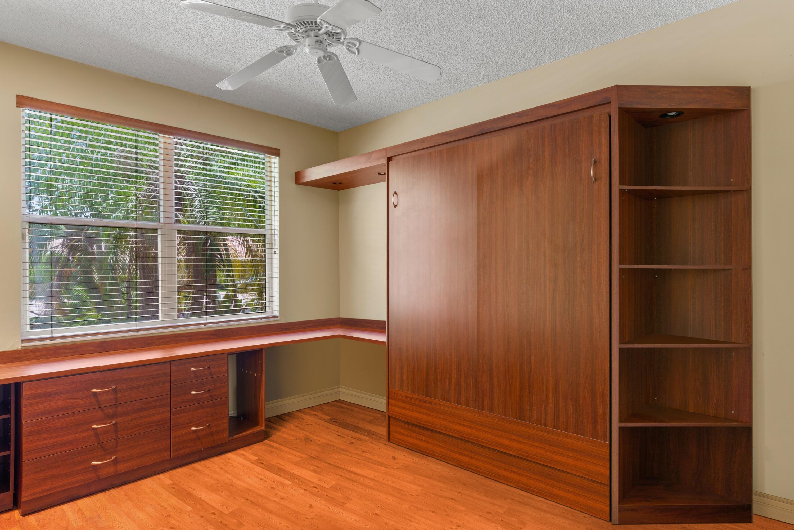 2687 Northwest 39th Street Boca Raton, FL 33434 - Photo 19 of 34 a room with window and closet