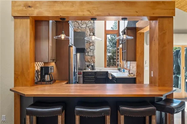 a dining table with chairs and wooden floor