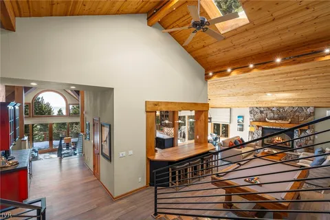 a living room with furniture and a dining table
