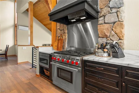 a kitchen with stainless steel appliances granite countertop a stove and a sink