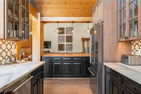 a kitchen with stainless steel appliances granite countertop a stove and a sink