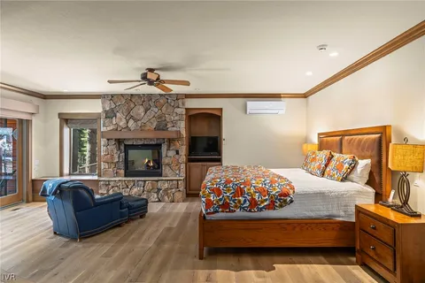 a bedroom with a bed and a fireplace