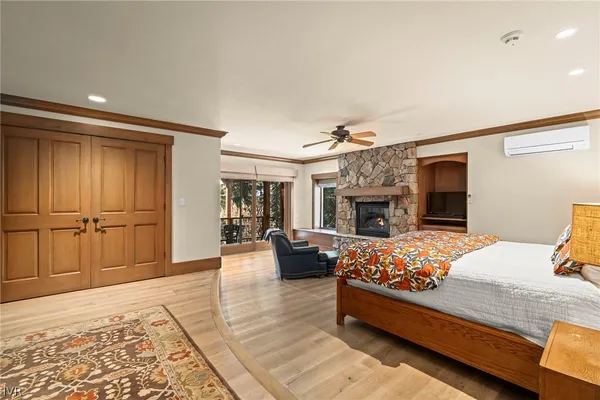 a bedroom with furniture and a fireplace