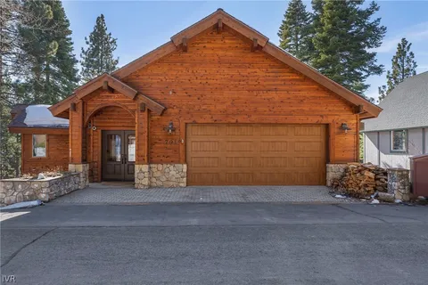 a front view of a house with a garage