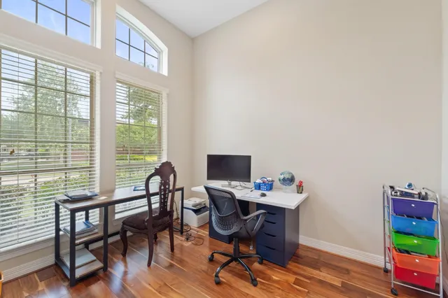 a view of a livingroom with furniture and a window