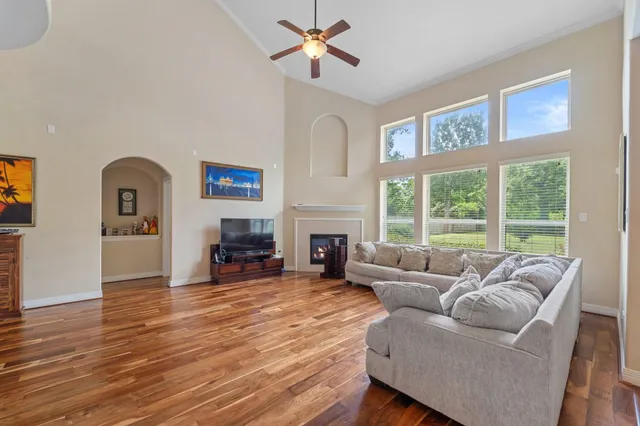 a living room with furniture and a fireplace