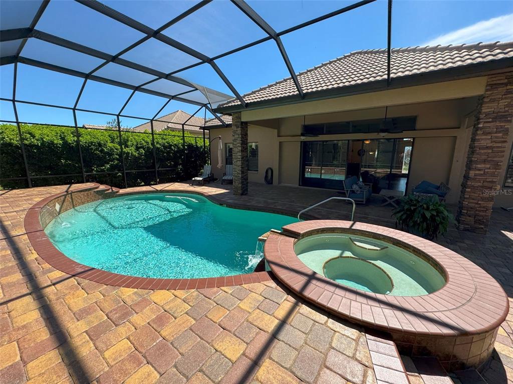 1024 West Beagle Run Loop Hernando, FL 34442 - Photo 38 of 44 a view of a swimming pool with a patio