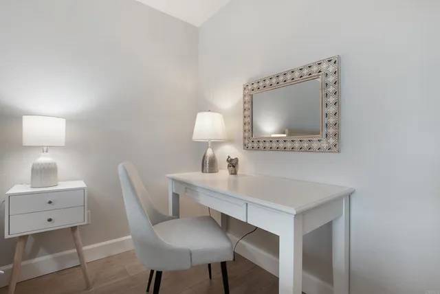 a view of a chair and table in a bathroom