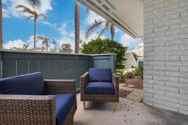 a view of a chair and table in the patio